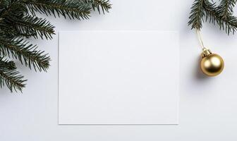 A white card with a gold ornament hanging from it photo