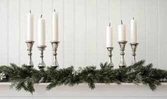 A row of candles are lit on a mantle photo