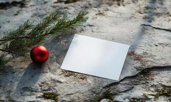 A white card with a red ball on top of it photo