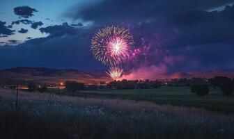 A field of grass with a large firework display in the sky photo