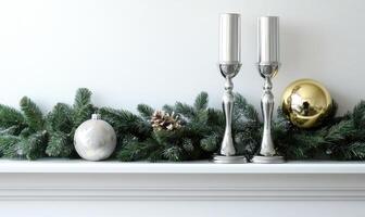 A mantle with a Christmas tree decoration and two candles photo