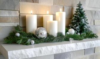 A shelf with candles and a tree on it photo
