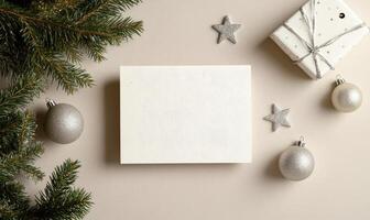 A white card with a star on it sits on a table with a Christmas tree photo