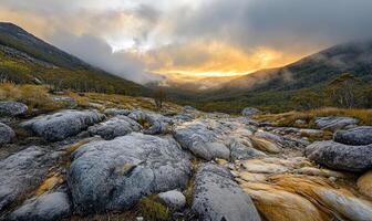 A rocky, mountainous landscape with a stream running through it photo