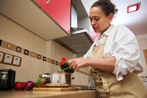 Woman preparing healthy meal in home kitchen setting photo