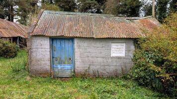 Old aged house in the forest, buildings and architecture at Kinnity, Offaly, Ireland photo
