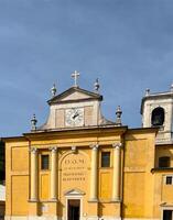 Church of Saint John Baptist in Cavaion Veronese VR, Italy. Historical architecture with a clock on the facade, classic Italian style photo