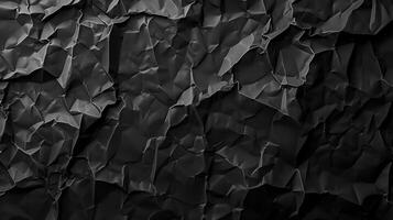 Black crumpled paper texture background with empty space for text photo