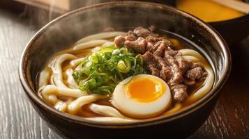 Japanese udon noodle with beef and egg on wooden table photo