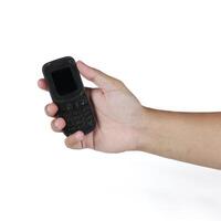 Hand holding mobile phone isolated on white background, clipping path included. photo
