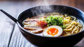 Steaming Bowl of Japanese Ramen with Chashu, Egg, and Rich Broth photo