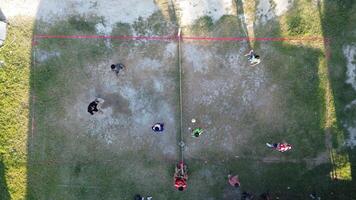 Aerial view of group of young men are playing takraw in the afternoon photo