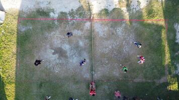 Aerial view of group of young men are playing takraw in the afternoon photo