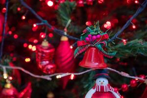 close up shot for christmas tree decorations and lights in red and green for celebration photo