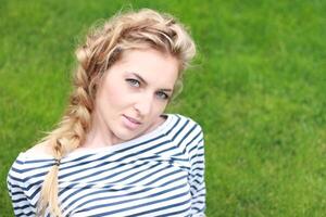 Girl on the green grass photo