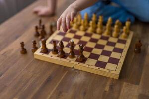 close up view of wooden chess pieces arranged on table,showcasing the intricate details each piece photo
