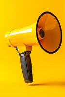 A yellow microphone with a black handle is on a yellow background. The microphone is turned off and is not in use photo