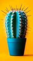 A green cactus is in a blue pot on a yellow background. The cactus is tall and has many spines photo