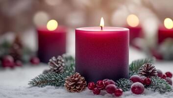 A lit candle sits on a table with pine cones and berries. The candle is surrounded by a wreath of pine needles and berries, creating a festive and cozy atmosphere photo