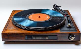 A record player with a blue record on it. The record player is wooden and has a black and orange record photo