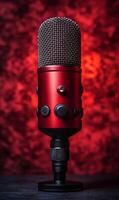Red microphone on display with a dramatic backdrop. A striking red microphone stands prominently against a textured backdrop, showcasing an elegant design suited for recording sessions. photo