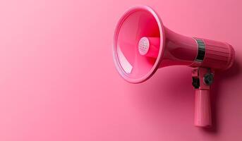 A pink microphone is on a pink background. The pink color of the microphone and the background creates a cheerful and vibrant mood. Concept of expressing oneself through music or public speaking photo