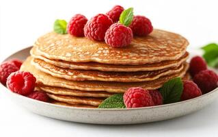 A stack of pancakes with raspberries on top. The pancakes are piled high and the raspberries are scattered around them. Concept of indulgence and satisfaction photo
