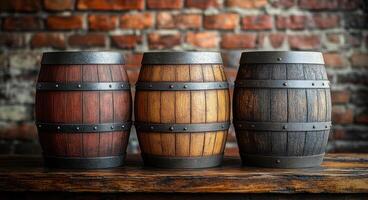 Three barrels of different colors are lined up on a wooden table. The barrels are made of wood and have a rustic appearance. The arrangement of the barrels creates a sense of depth and dimension photo