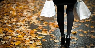 A woman is walking down a street with shopping bags in her hands. The image has a mood of leisure and shopping, as the woman is carrying bags and he is enjoying her time photo
