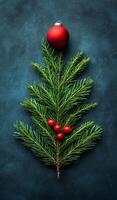 A Christmas tree made of pine needles and berries with a red ornament on top. The image conveys a festive and joyful mood, as it represents the holiday season and the spirit of giving and celebration photo