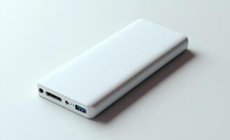 A white power bank is sitting on a white surface. The white color of the power bank and the surface creates a sense of cleanliness and simplicity photo