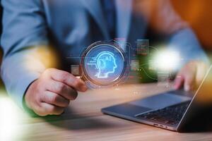 businessman uses magnifying glass and a laptop to connect artificial intelligence to search for information, Chatbot with AI, use command prompt for generates idea something or solve problems. photo