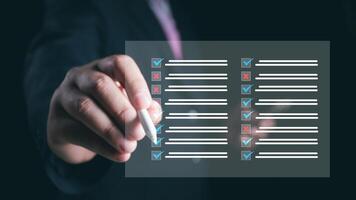 Businessman check electronic documents on digital documents and checklist approve, online evaluation of business on virtual interface, Communication technology concept. photo