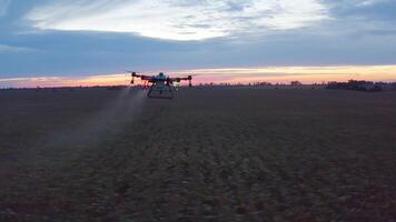 A drone is spraying a field with a crop video