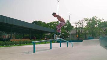 A man on a skateboard doing a trick on a rail video