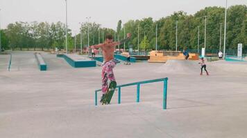 A man on a skateboard doing a trick on a rail video