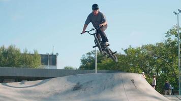 A man on a bike doing a trick on a ramp video