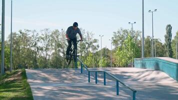 A man on a skateboard doing a trick on a rail video