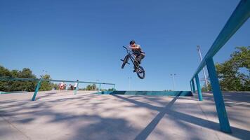 A man on a bike doing a trick on a ramp video