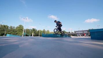 A man on a bike doing tricks on a ramp video