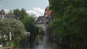 Ulm, Germany. Streets of old European city of Ulm in Bavaria in summer in sunny weather. People walking in historic town center of Ulm. Old town and tourists walking around attractions. video