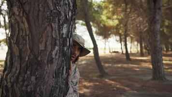 Scared Soldier Hides Behind A Trunk Of Tree From The Enemy's Imminent Attack video