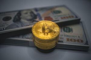 Golden Bitcoin Stack with US Dollar Background. photo