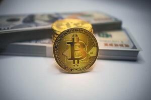 Golden Bitcoin Coin with US Dollar Bills in the Background. photo