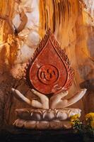Buddhist statue inside Asian sacred temple in the Am Phu Cave in the Marble Mountains in Da Nang in Vietnam in Asia photo
