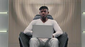 Futurism African American man male programmer designer cyber security database business businessman guy in white futuristic room indoors modern technology work online shake finger no not reject deny video