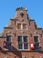 A building with a clock on it in holland photo