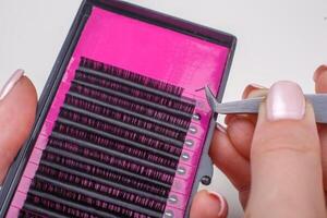 Eyelash Extension tools on white background. Accessories for eyelash extensions. Artificial lashes. photo