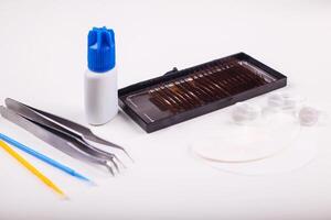Eyelash Extension tools on white background. Accessories for eyelash extensions. Artificial lashes. photo