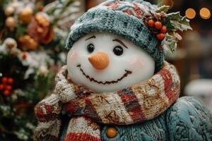 Smiling snowman wearing knitted clothes during snowfall at christmas market photo